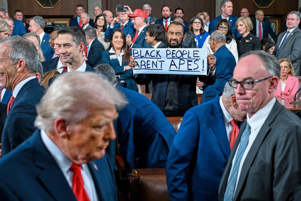 Rep. Al Green, D-Texas, holds up a sign as President Donald J. Trump walks by on his way to deliver the State of the Union address at the US Capitol.