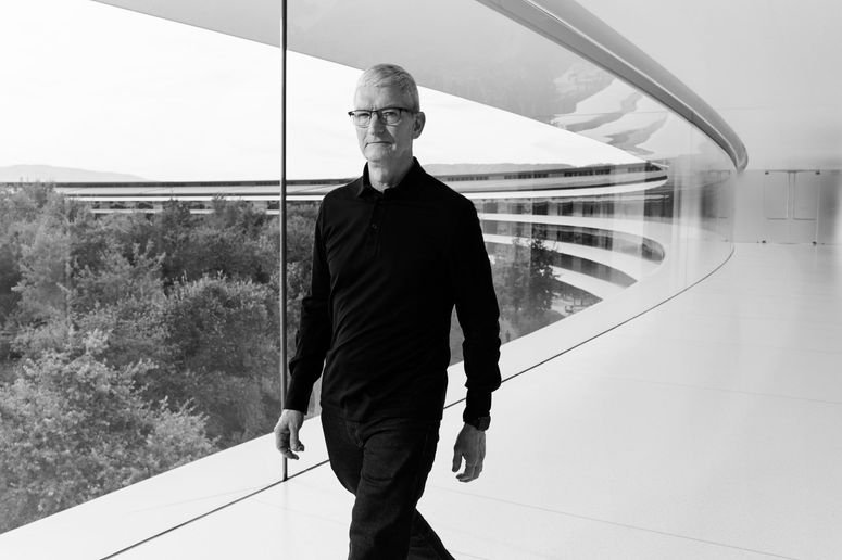 Image may contain: Tim Cook, Person, Walking, Adult, Accessories, Glasses, Blazer, Clothing, Coat, Jacket, Face, and Head