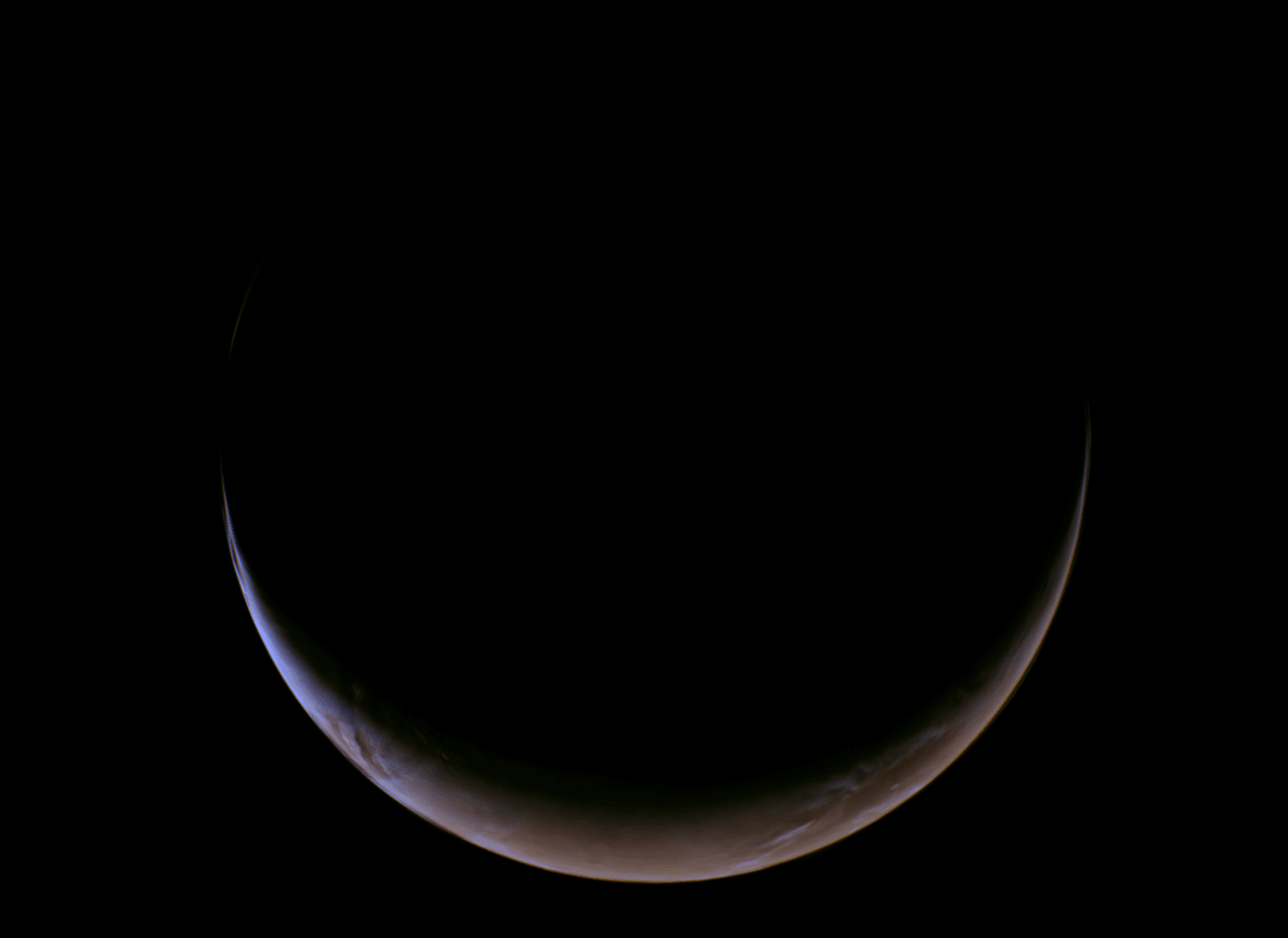 Una de las primeras fotos que tomó la misión Psique. Es Marte en su face creciente como si fuera la Luna. El imagen est...